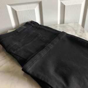 Black “slim flare” size 18 button front high rise